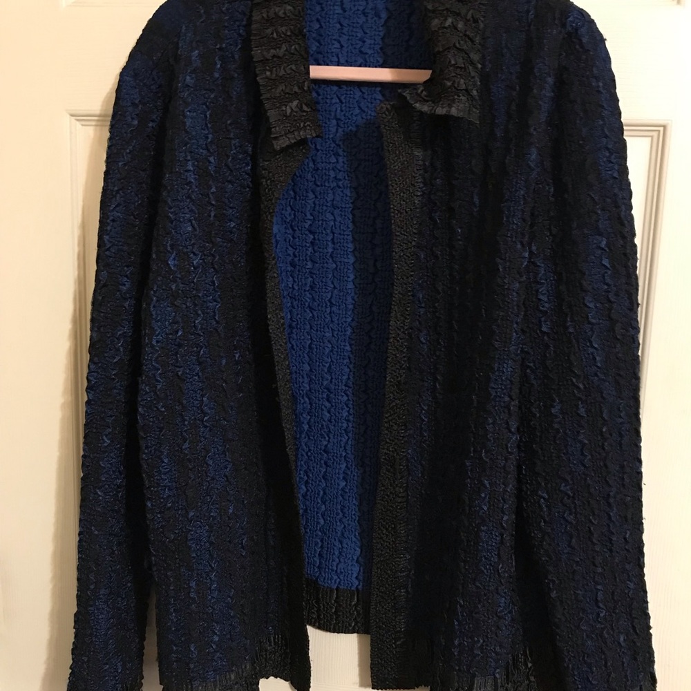 No tags pre-owned sweater very nice blue & black & blue colors.  Light weight